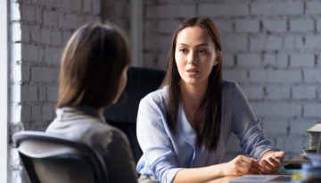 Serious,Professional,Female,Advisor,Consulting,Client,At,Meeting,Talking,Having